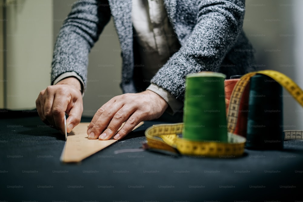 a man is working on a piece of wood