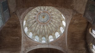 the ceiling of a building with a large dome