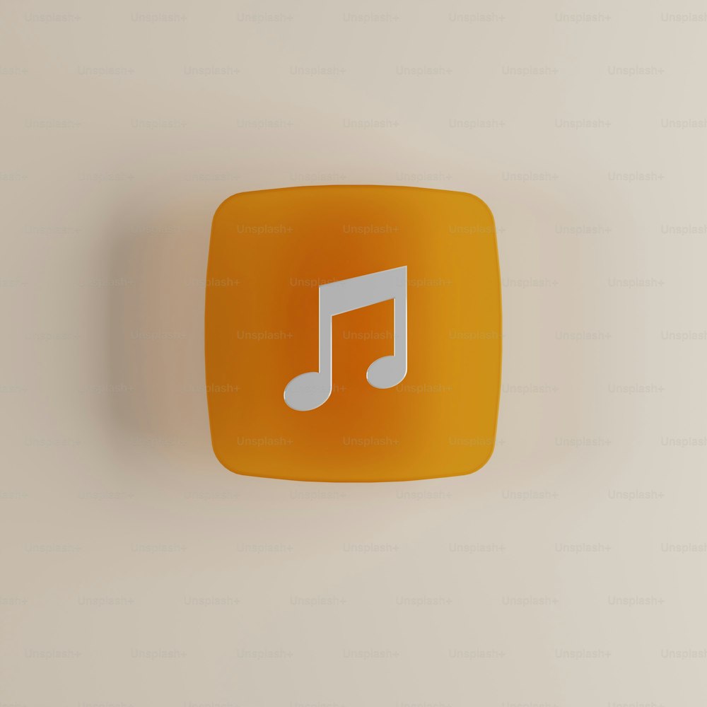 um botão quadrado laranja com uma nota musical sobre ele