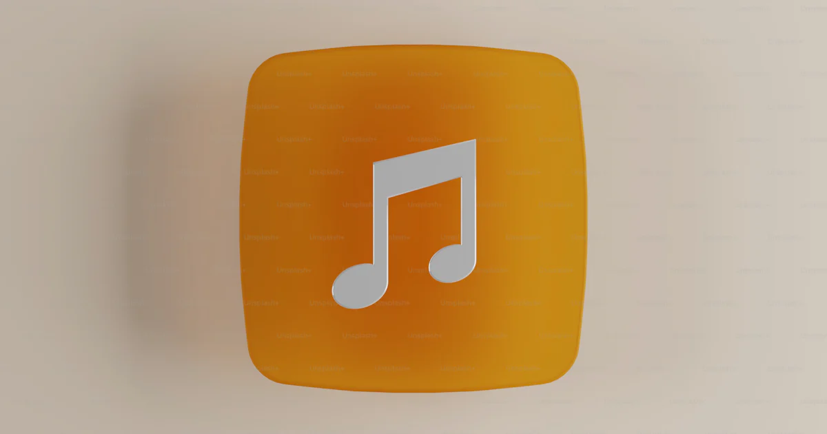 An orange square button with a musical note on it photo – Music notes ...