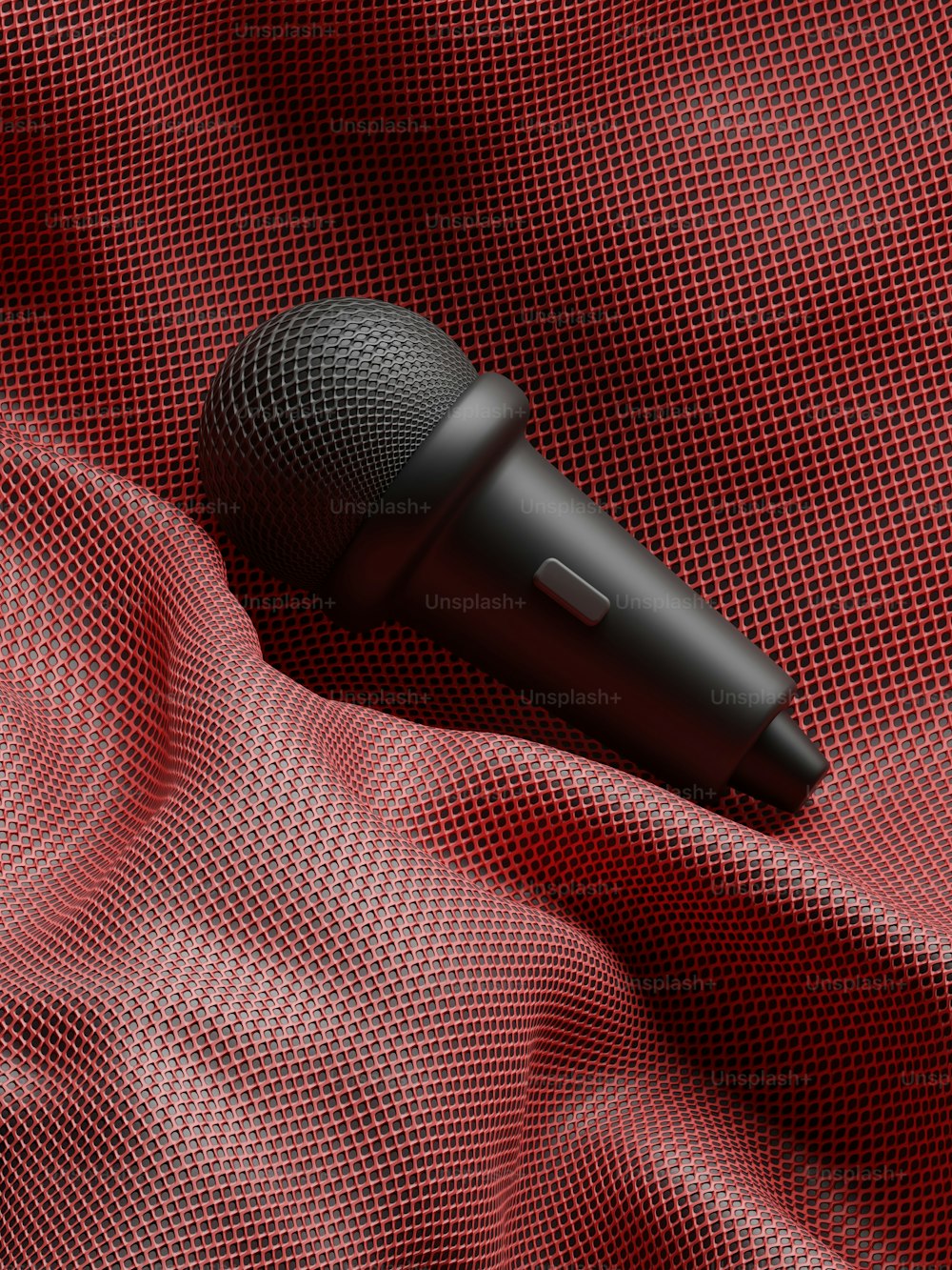 a black microphone on a red cloth