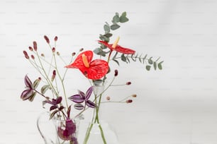 a vase filled with flowers on top of a table