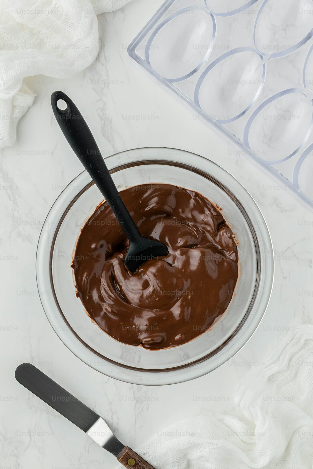 a bowl of chocolate with a spoon in it