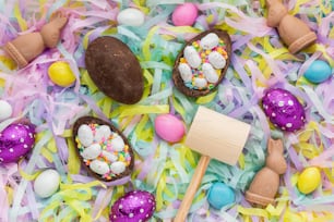a table topped with chocolate eggs covered in sprinkles