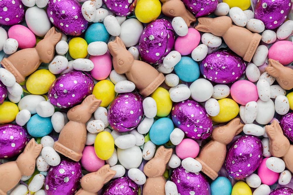 a close up of a pile of candy eggs