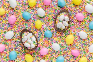 a table topped with chocolate eggs and sprinkles