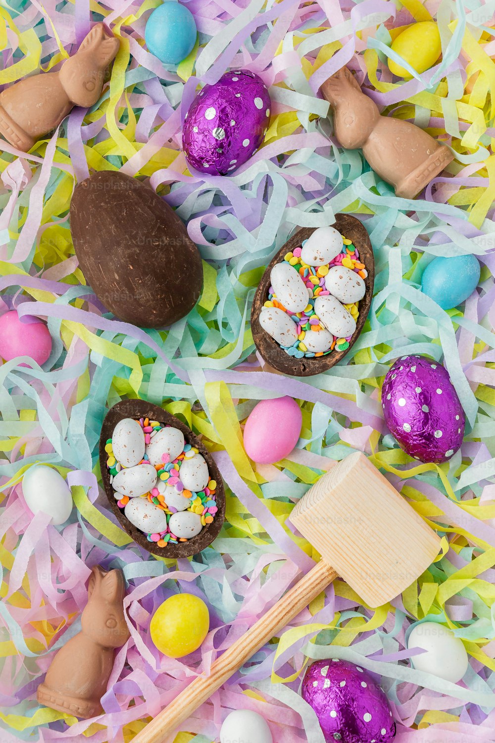 a table topped with chocolate eggs and candy