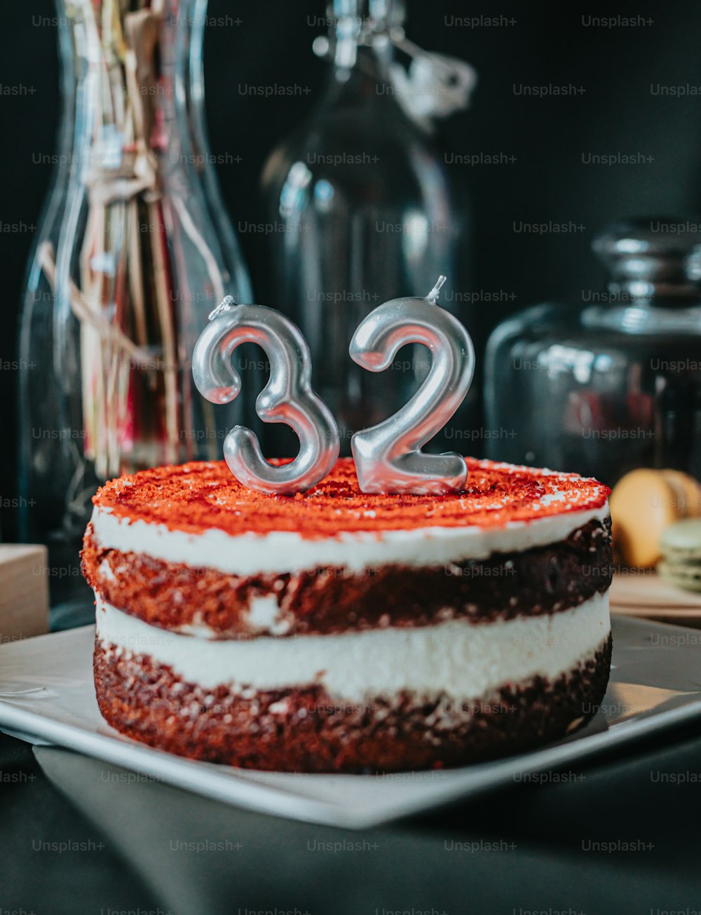 a red and white cake with the number 32 on it