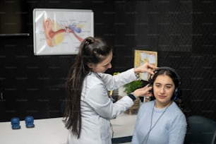a woman getting her hair styled by a hair stylist