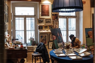 a person sitting at a table in a room