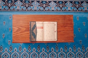 a wooden table with a book on top of it