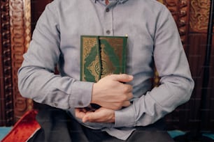 a man holding a book in his hands