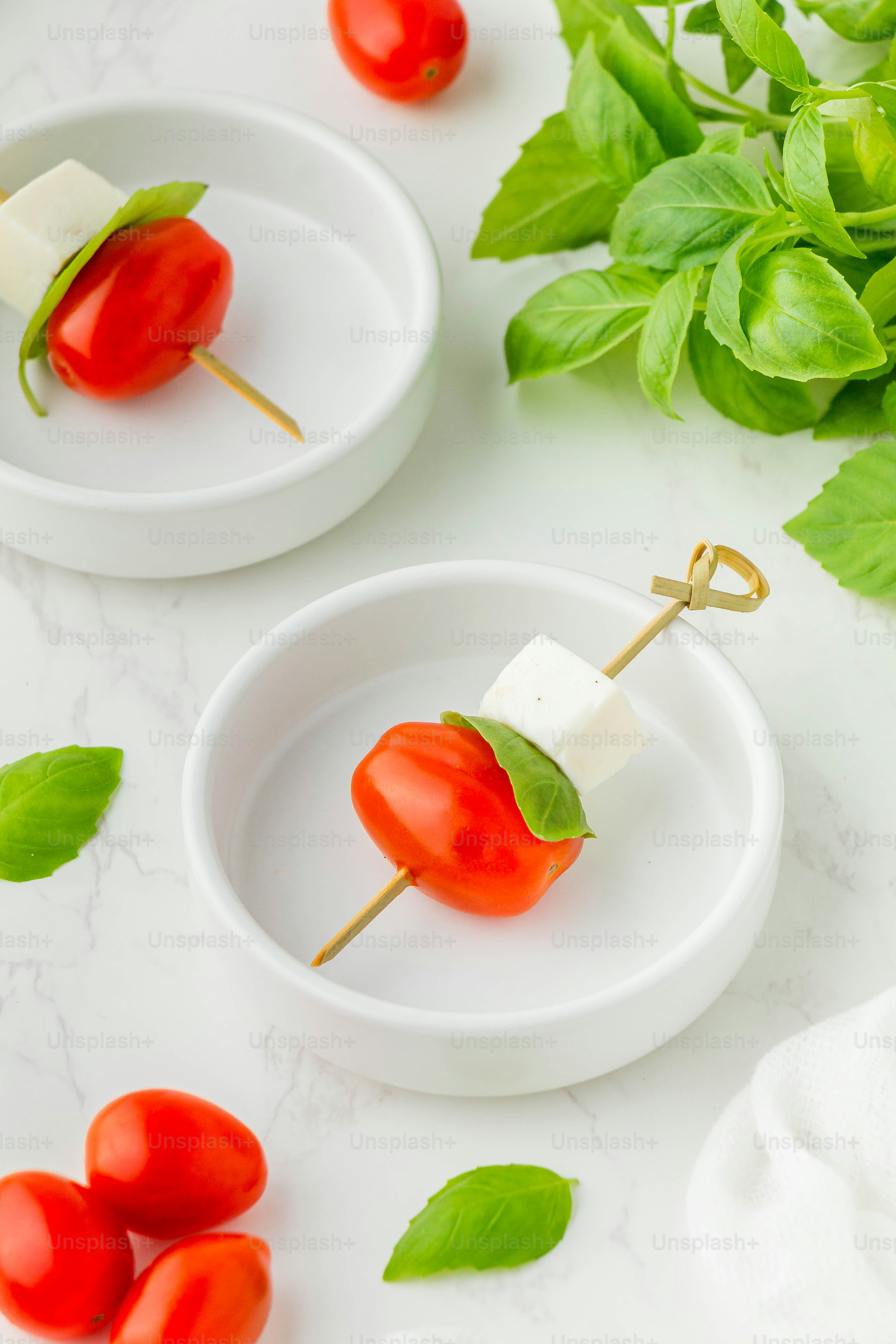 a couple of small white plates filled with food