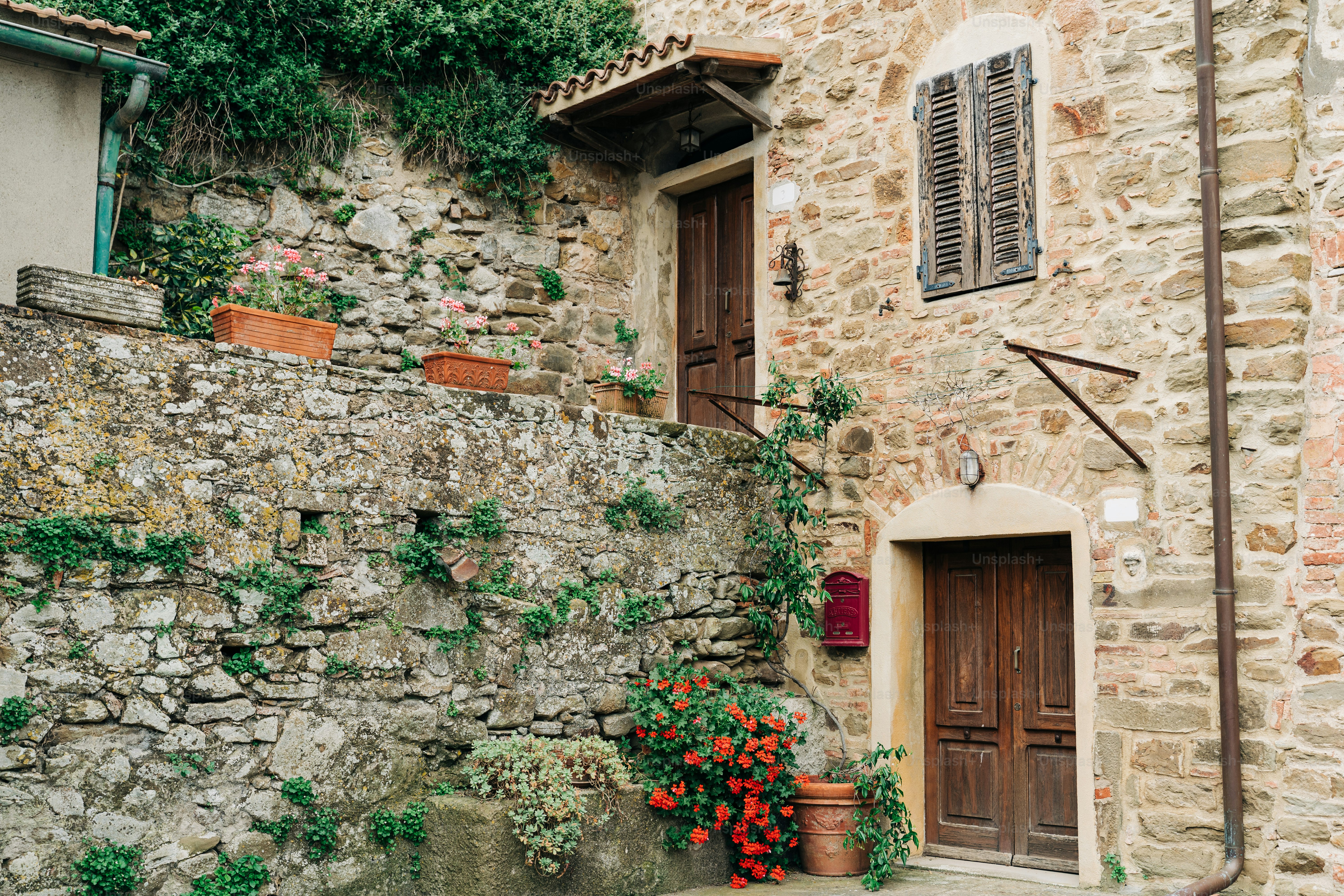a stone building with a door and window