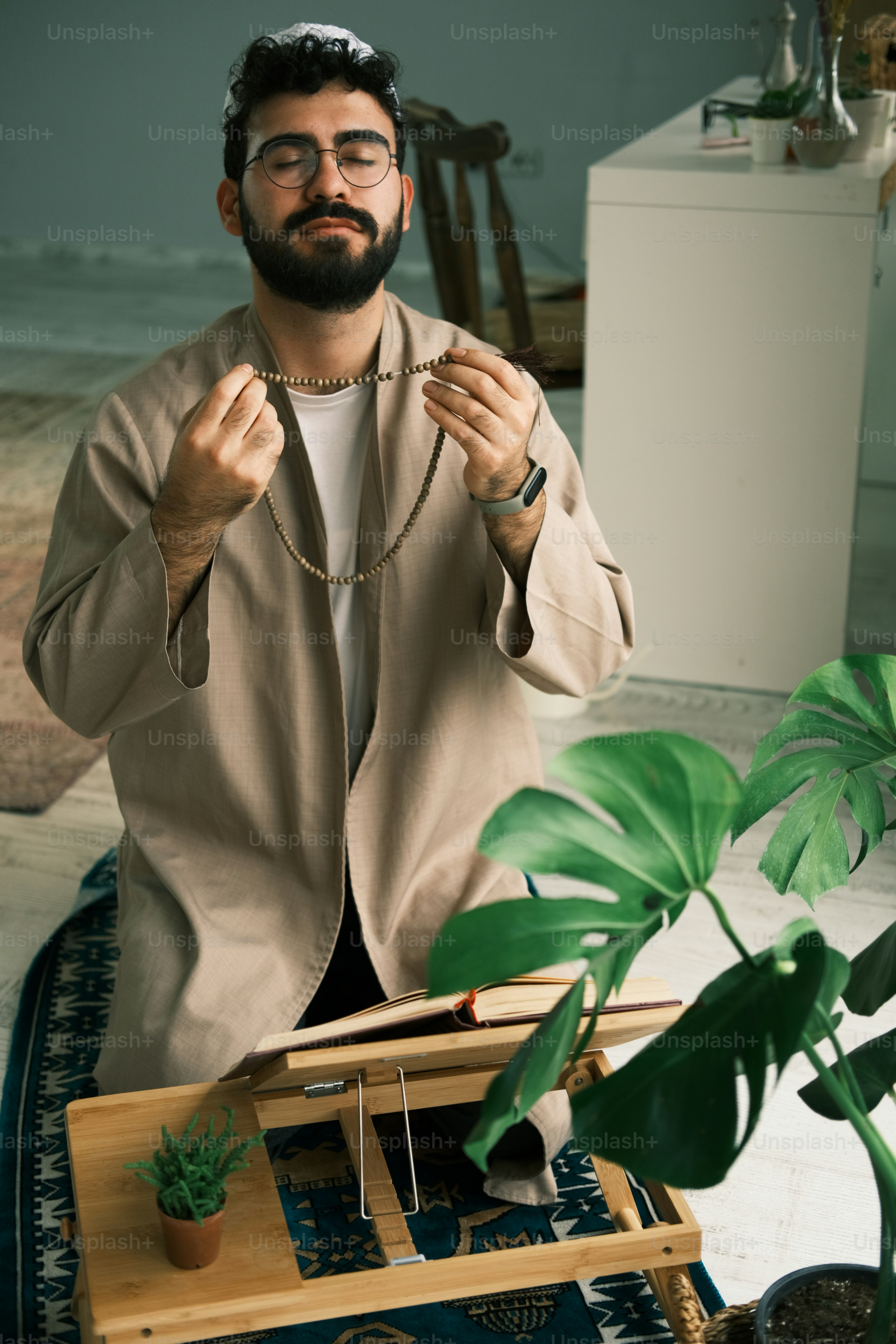 a man with a beard wearing a necklace