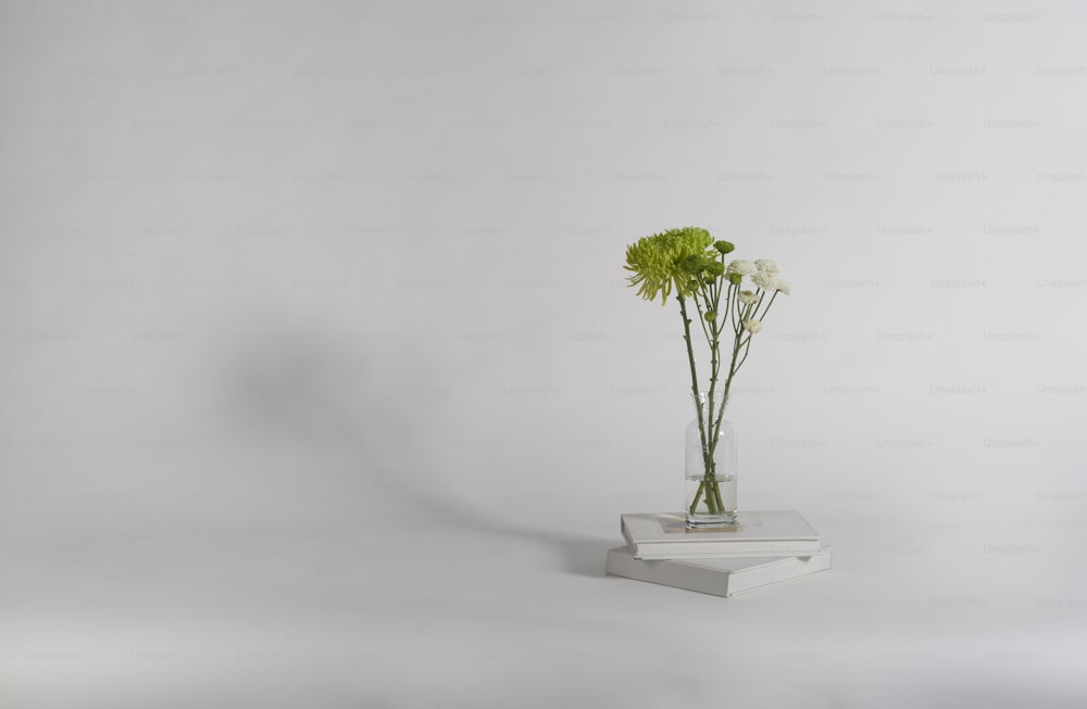 a small vase with some flowers in it