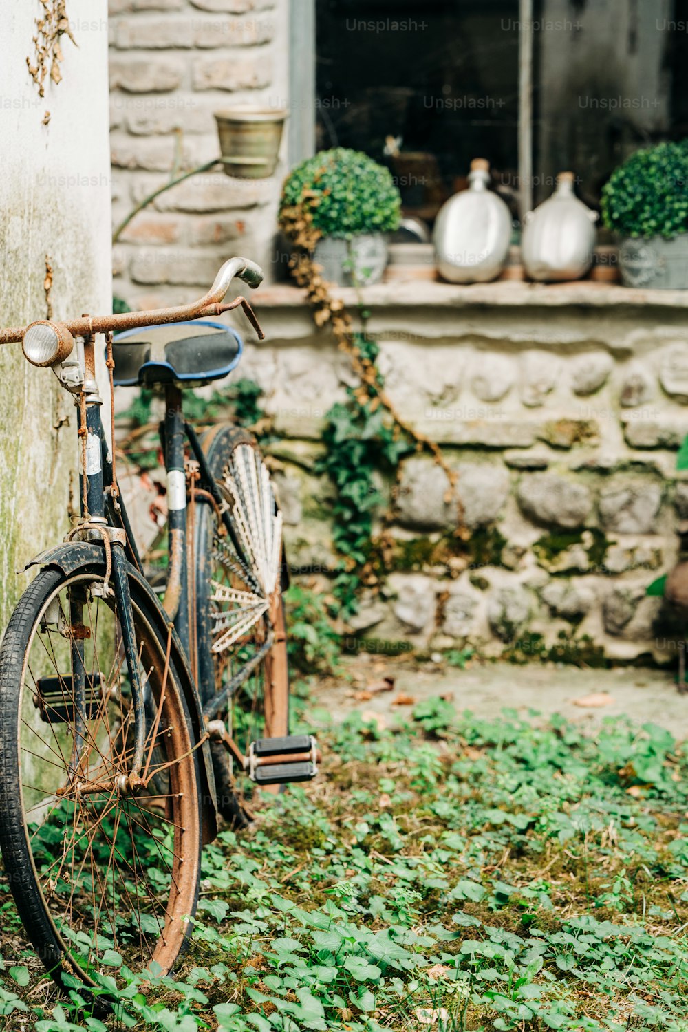 an old bicycle is parked outside of a house