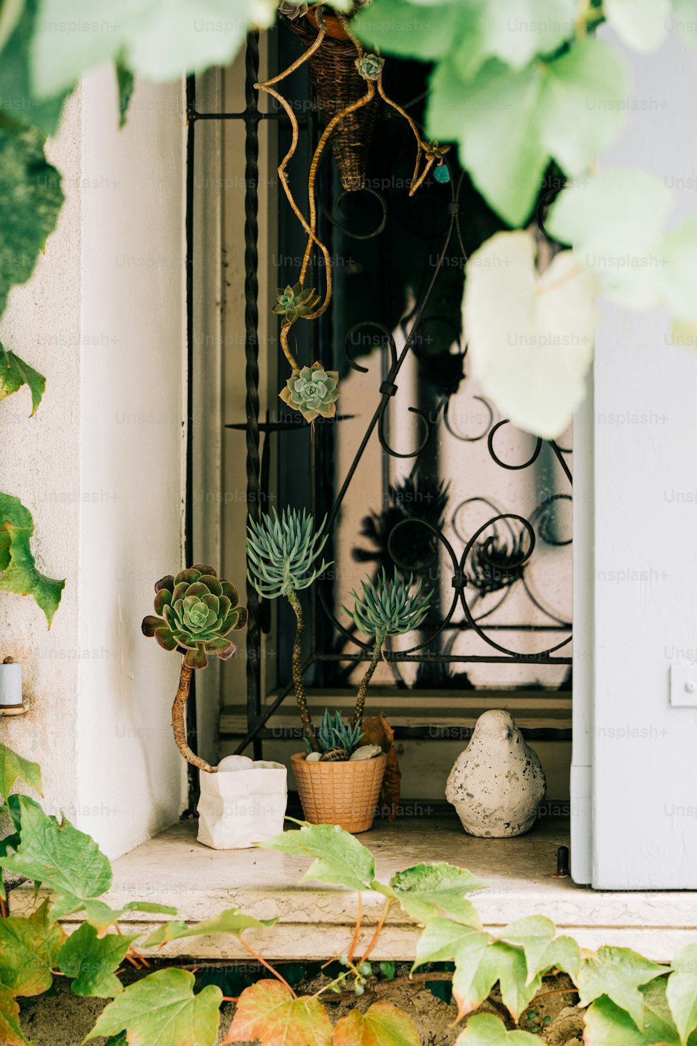 a window sill with a potted plant next to it