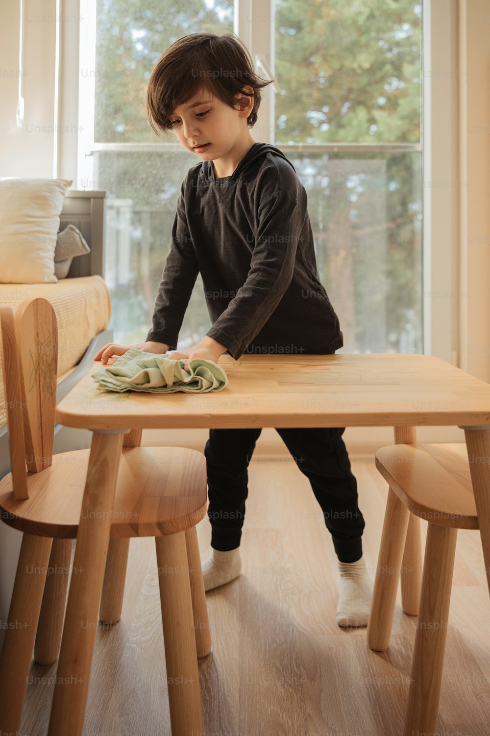 a little boy that is sitting at a table