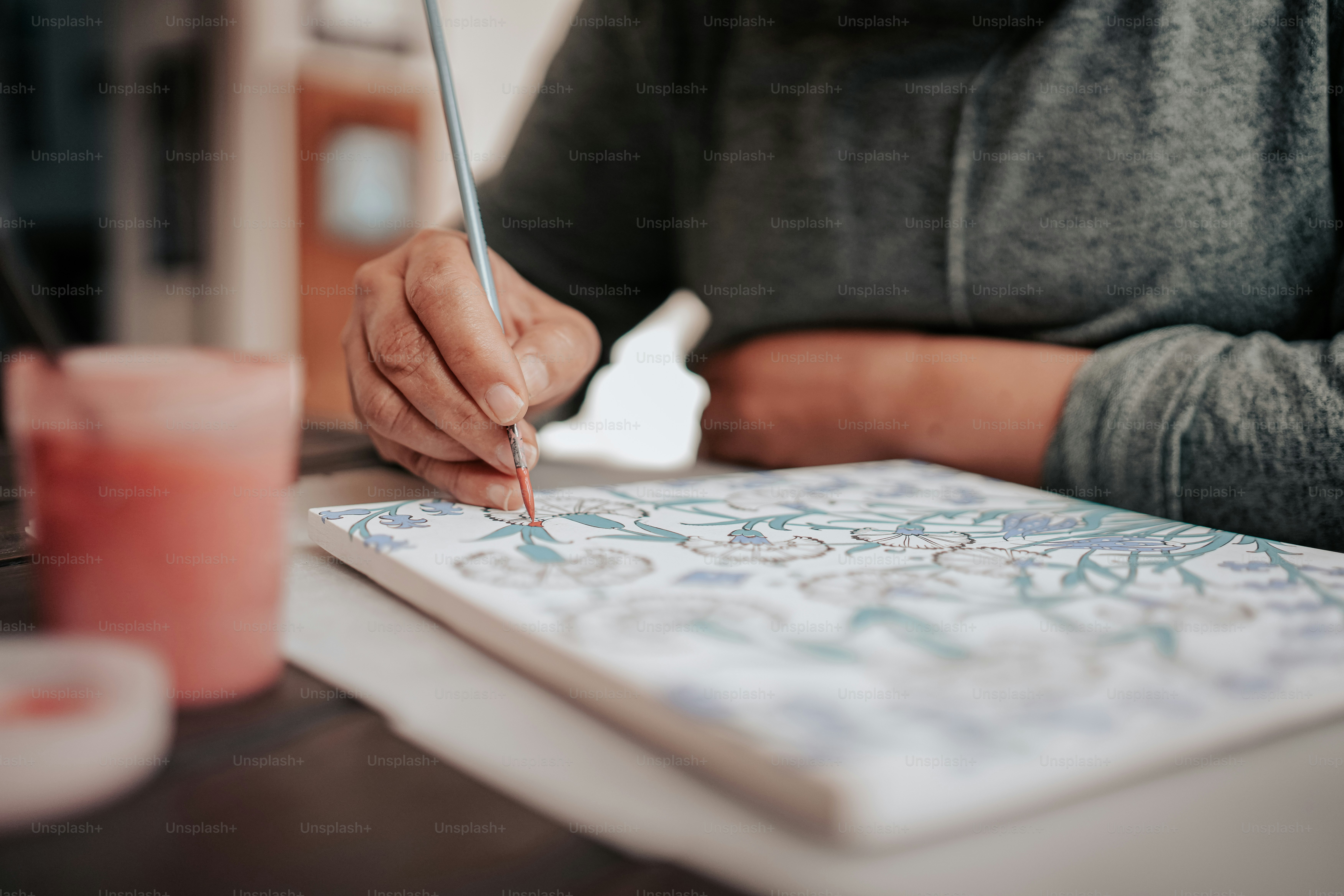 a person is writing on a piece of paper