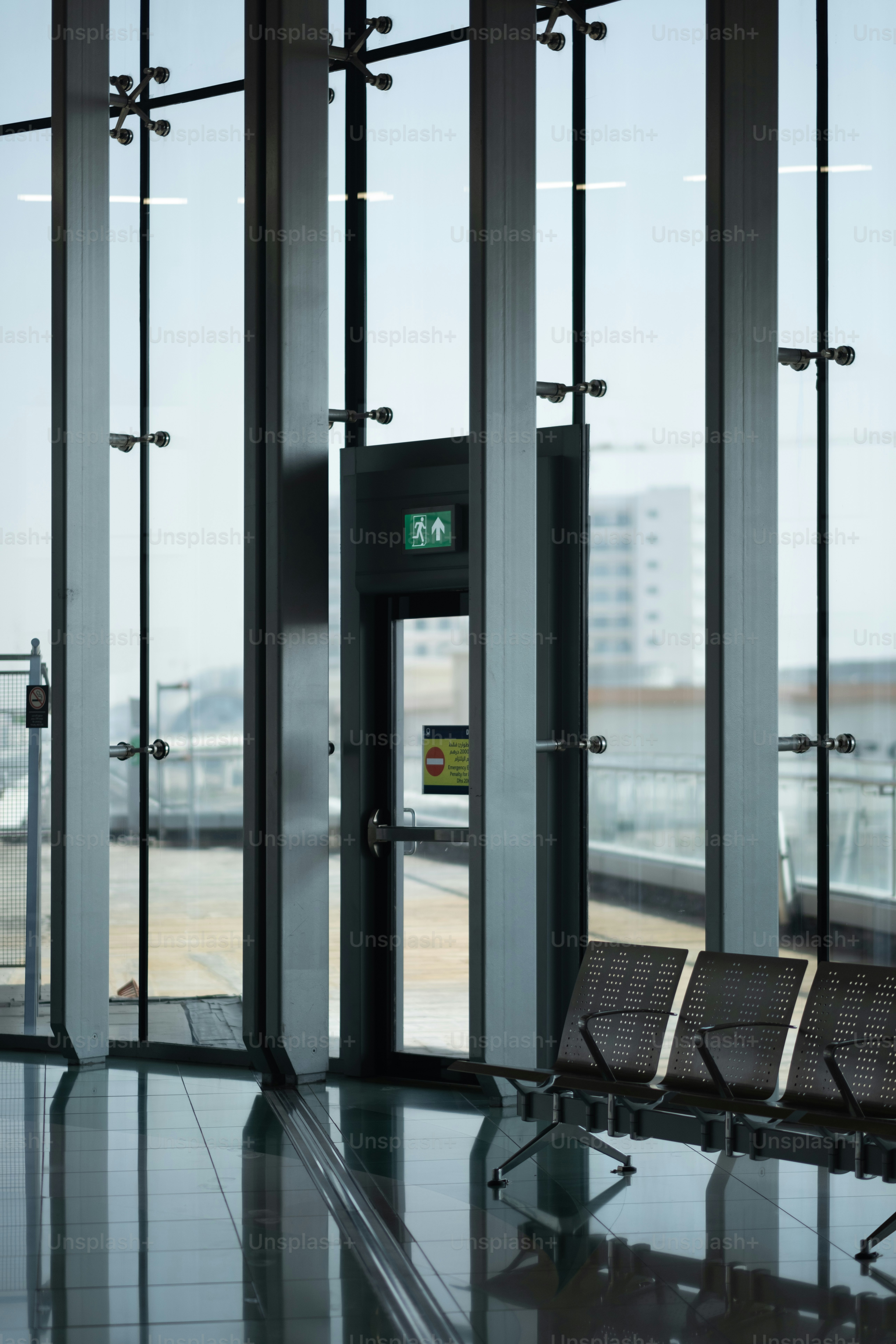 a couple of chairs sitting in front of a window