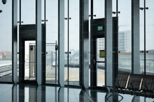 a bench sitting in front of an open door