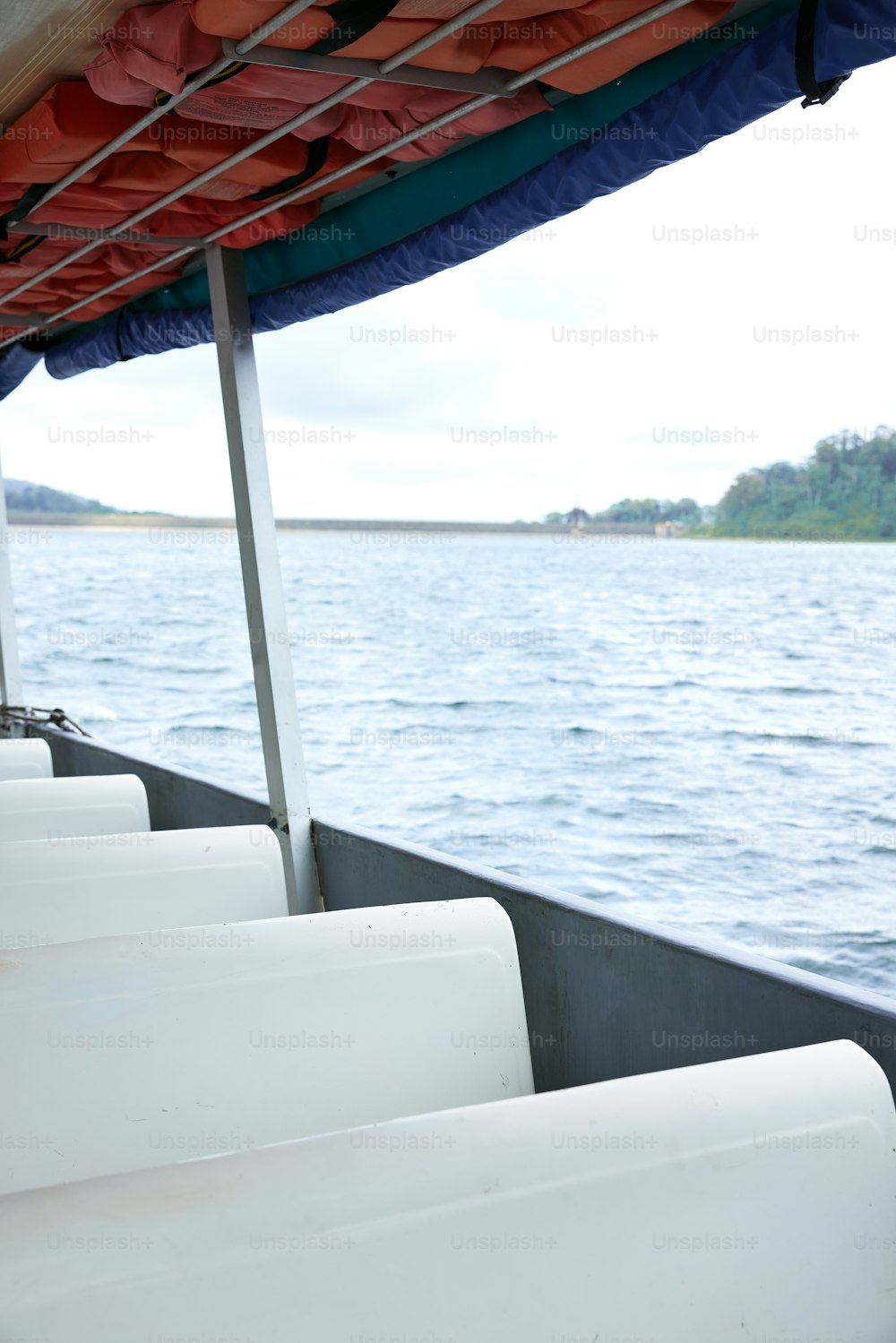 a row of seats sitting on the side of a boat