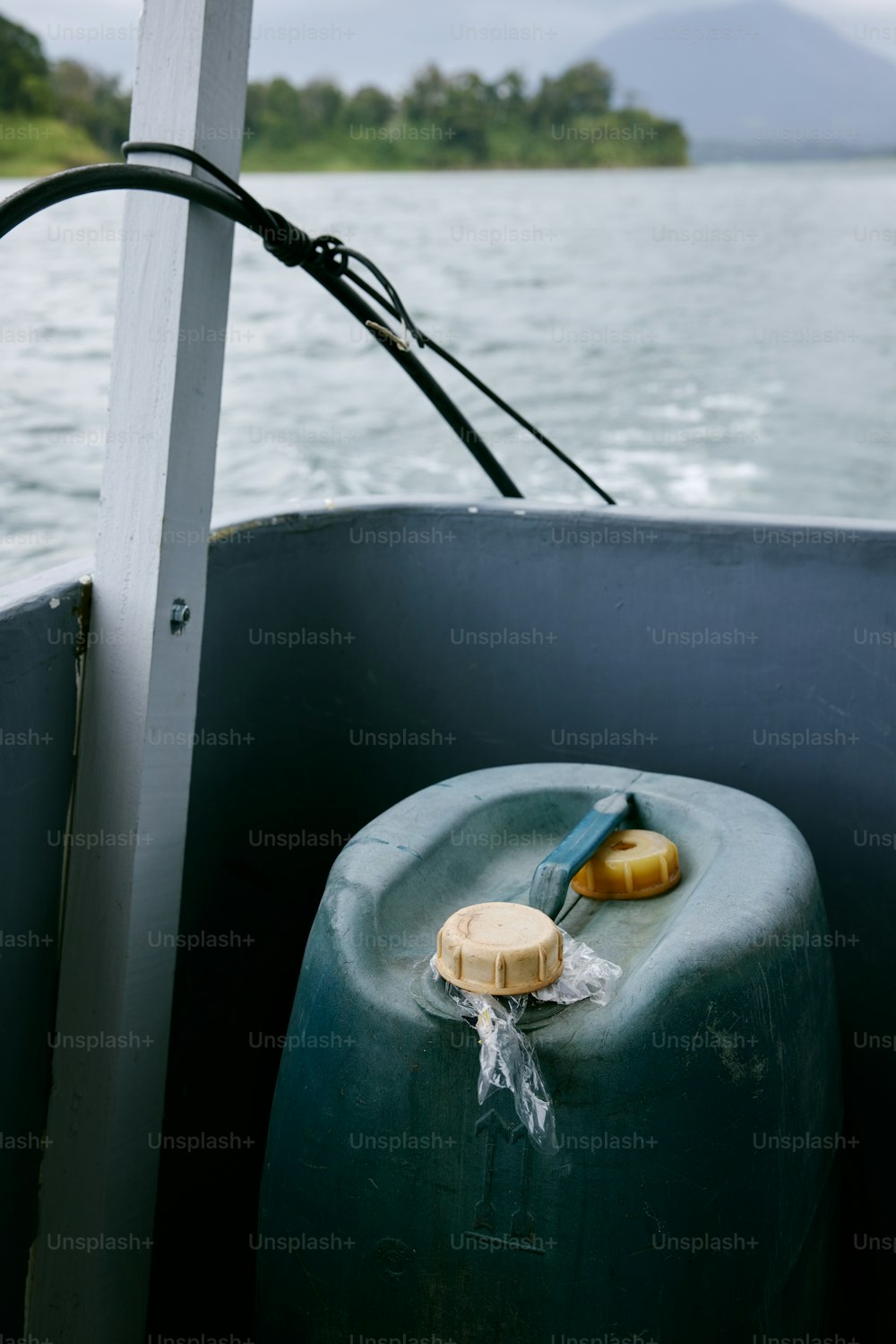 a large green container sitting on top of a boat