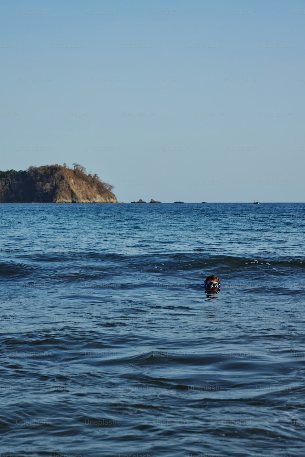 a person swimming in a body of water