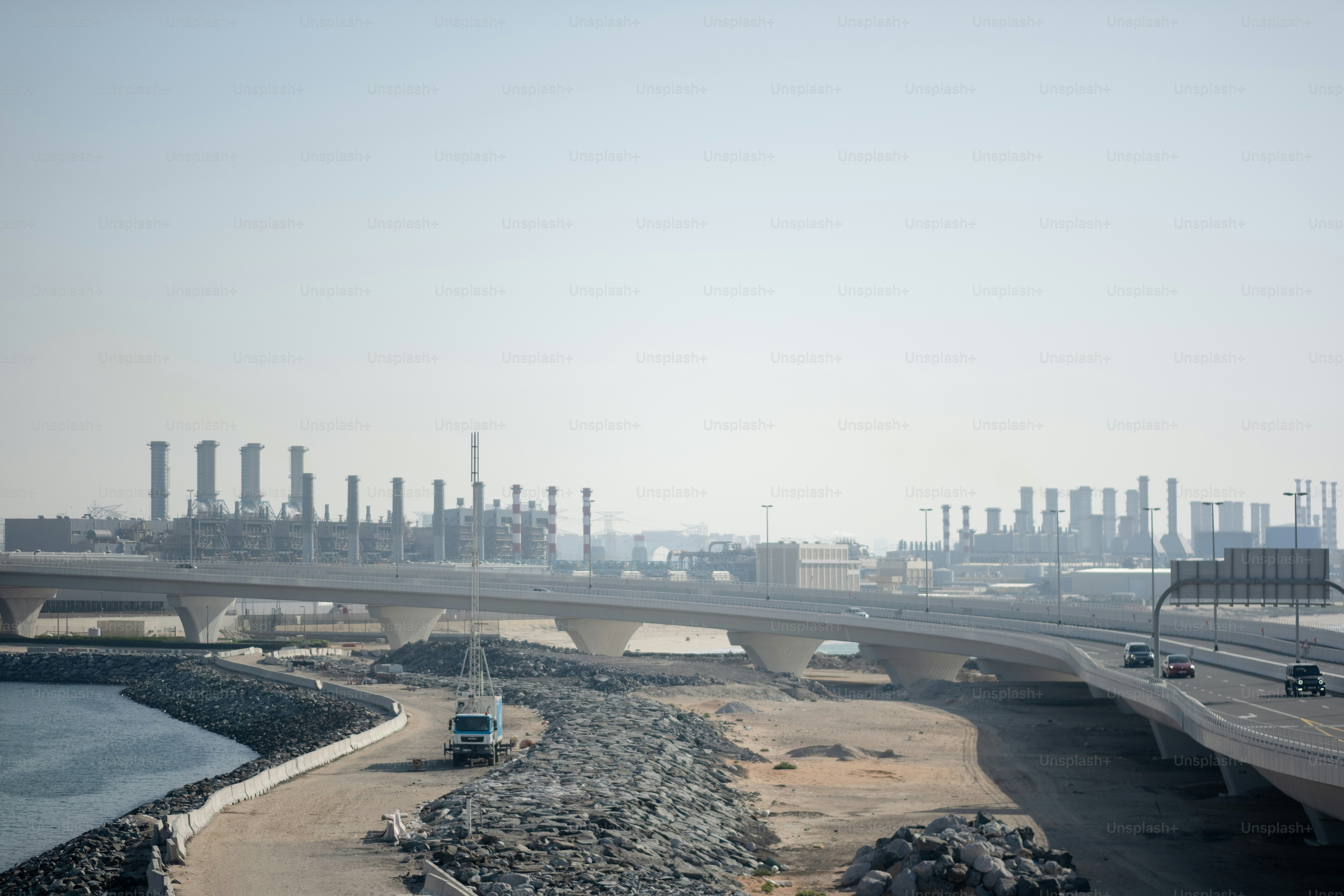 Industry and transportation springing up around reclaimed land.