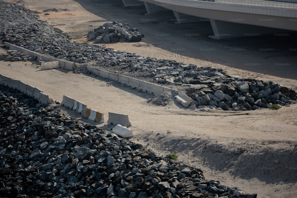 a pile of rocks sitting next to a road