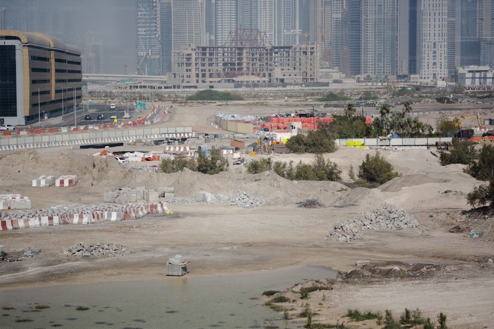 a construction site with a lot of buildings in the background