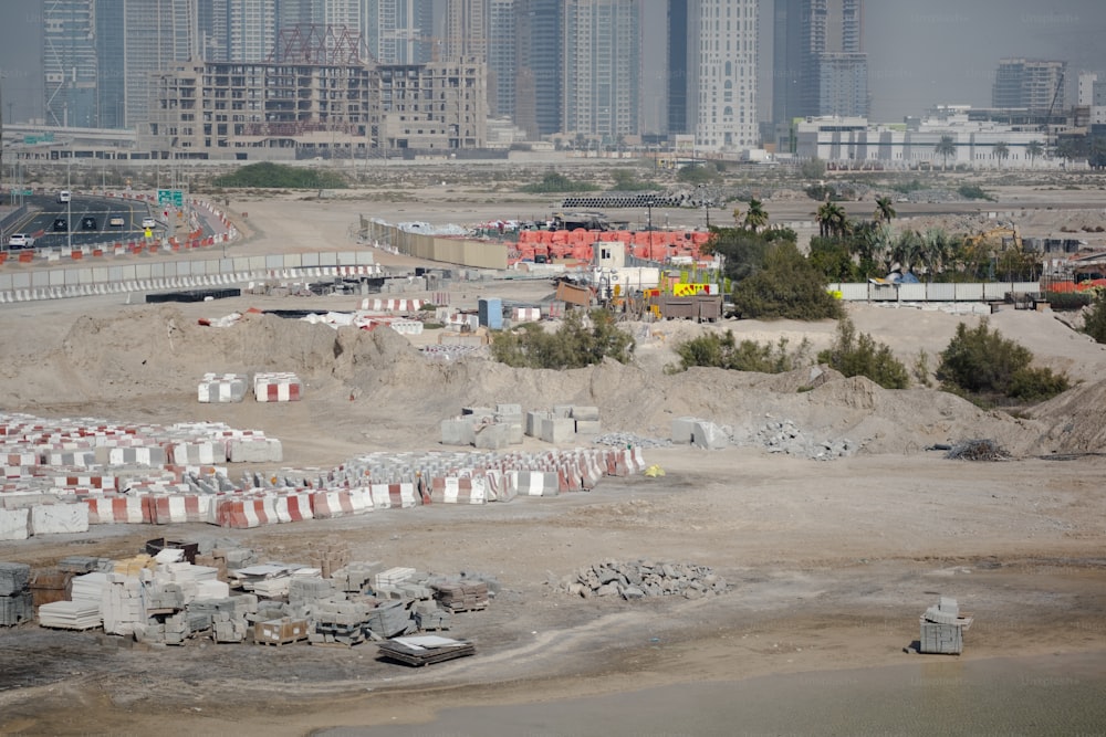 a construction site with a lot of buildings in the background