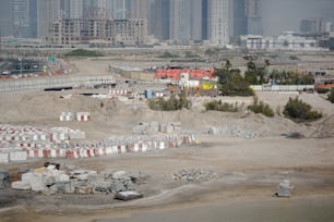 a construction site with a lot of buildings in the background