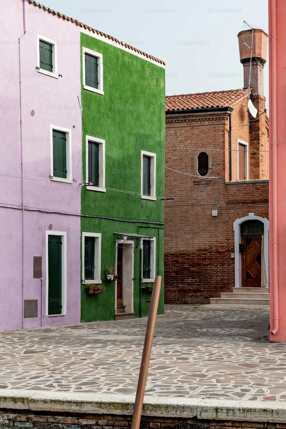 a row of colorful buildings next to each other