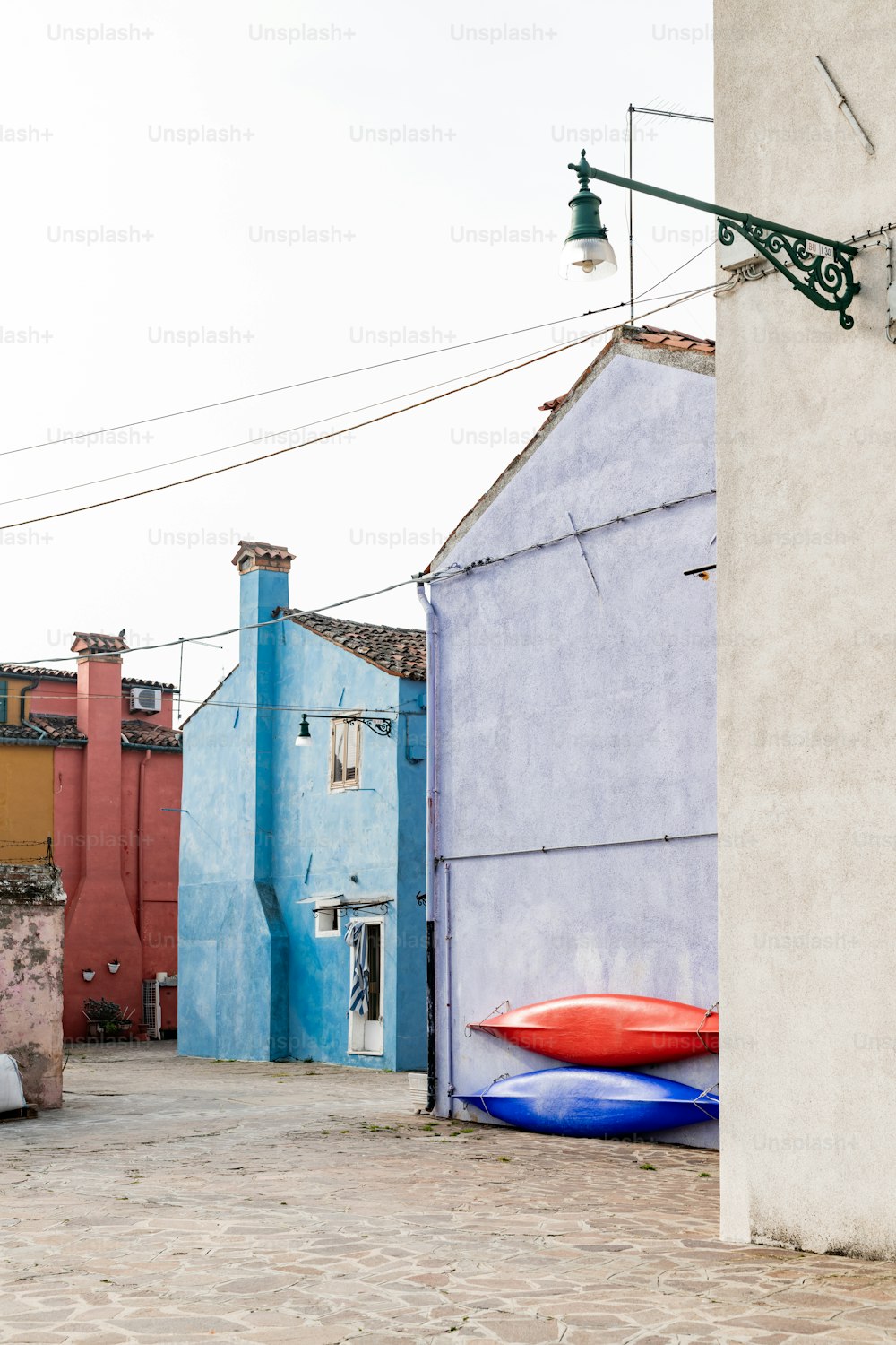 a row of houses with a boat painted on the side of the building