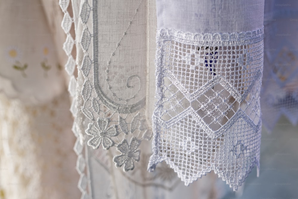 a close up of a curtain with lace on it