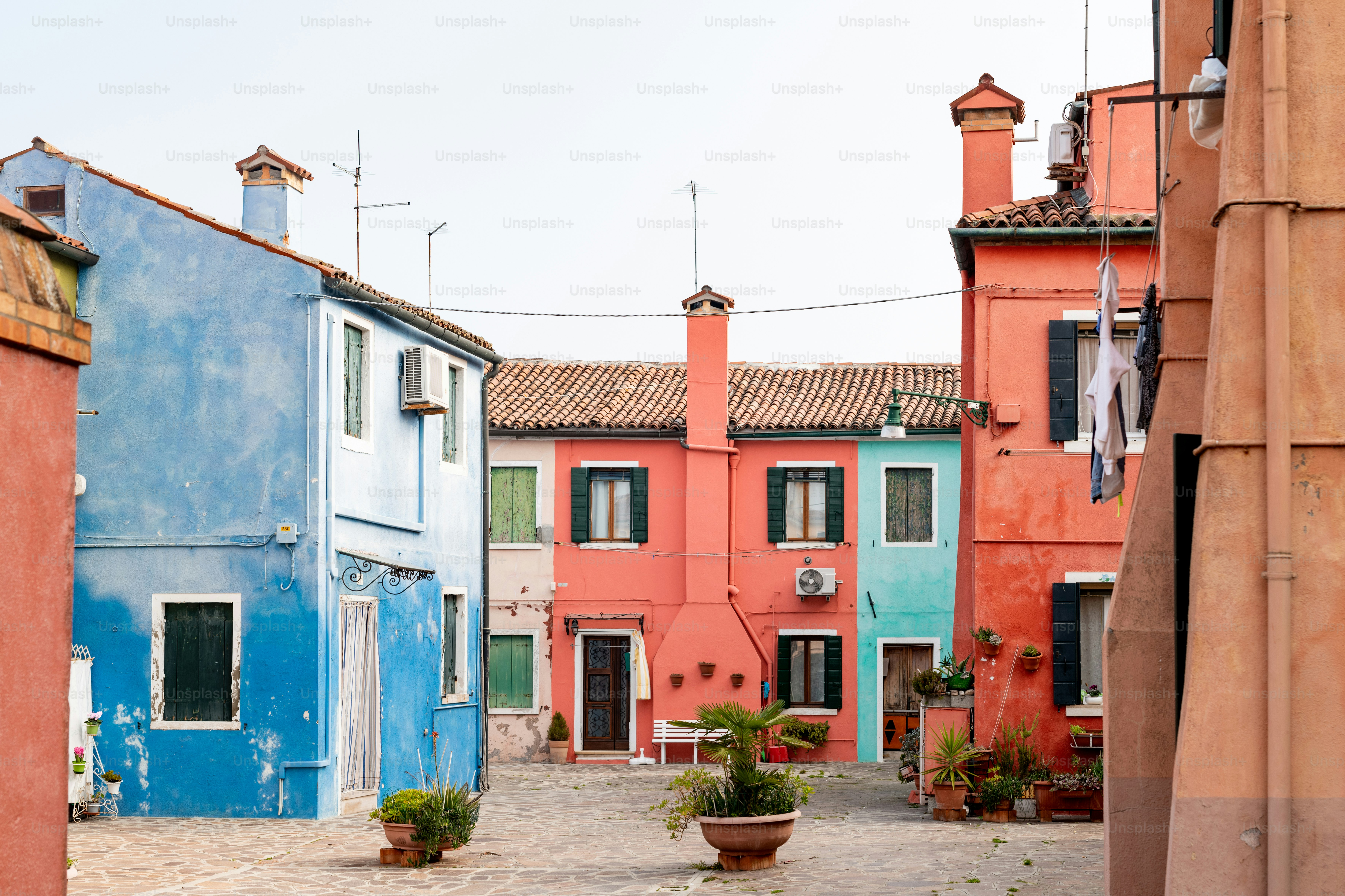 a cobblestone street lined with colorful buildings