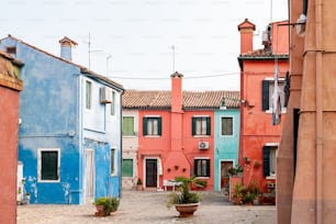 a cobblestone street lined with colorful buildings