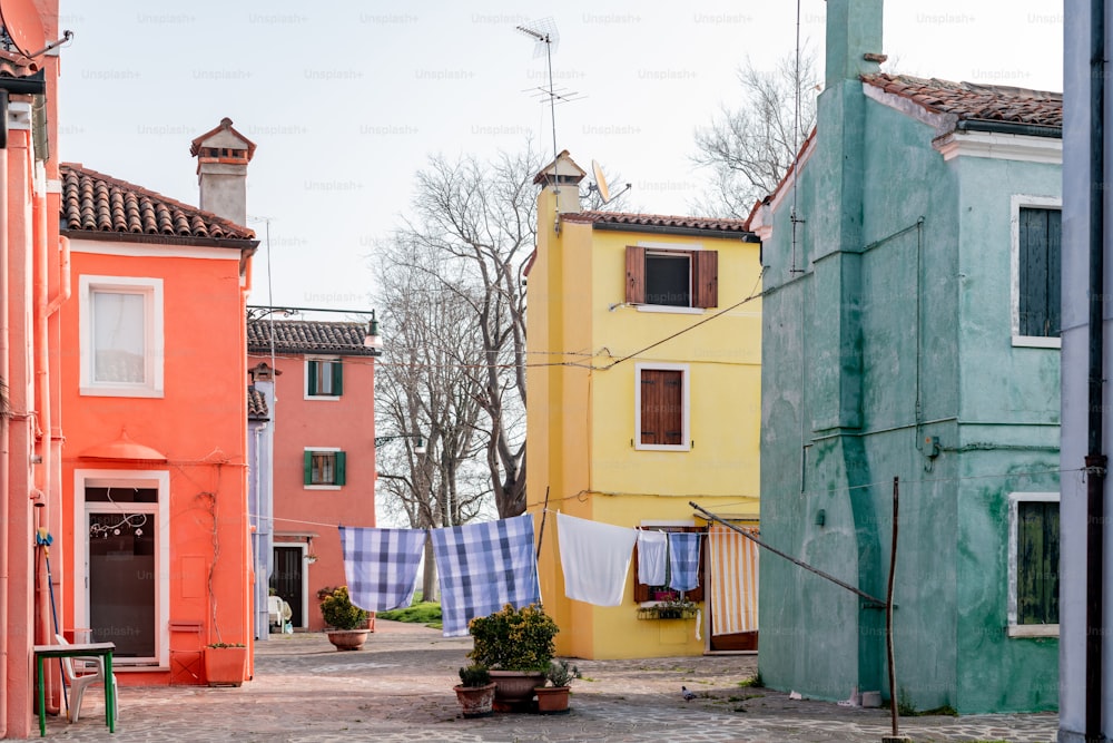 a row of houses with clothes hanging out to dry