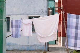 a couple of clothes hanging on a clothes line