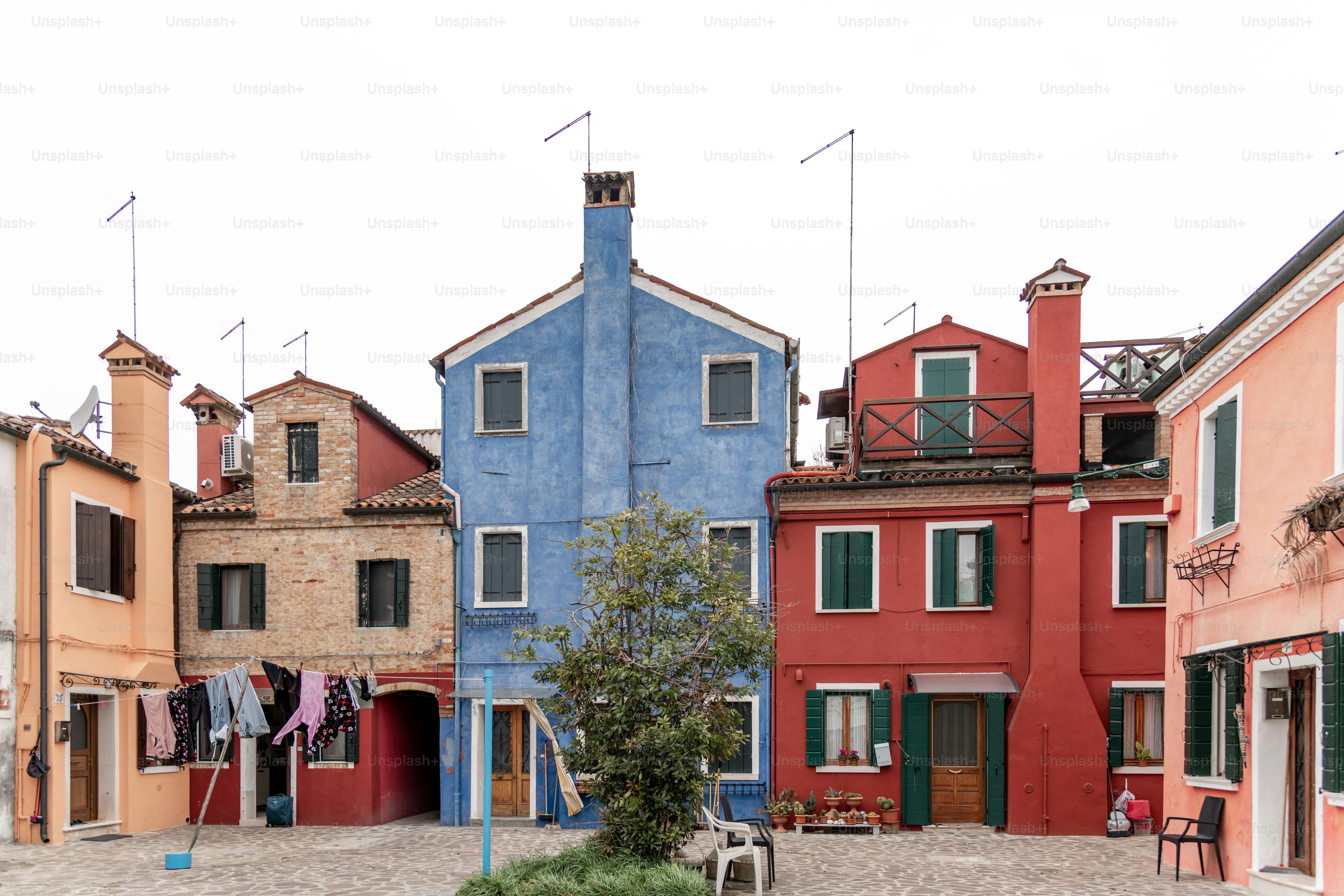 a row of buildings with clothes hanging out to dry
