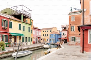 a row of buildings next to a body of water