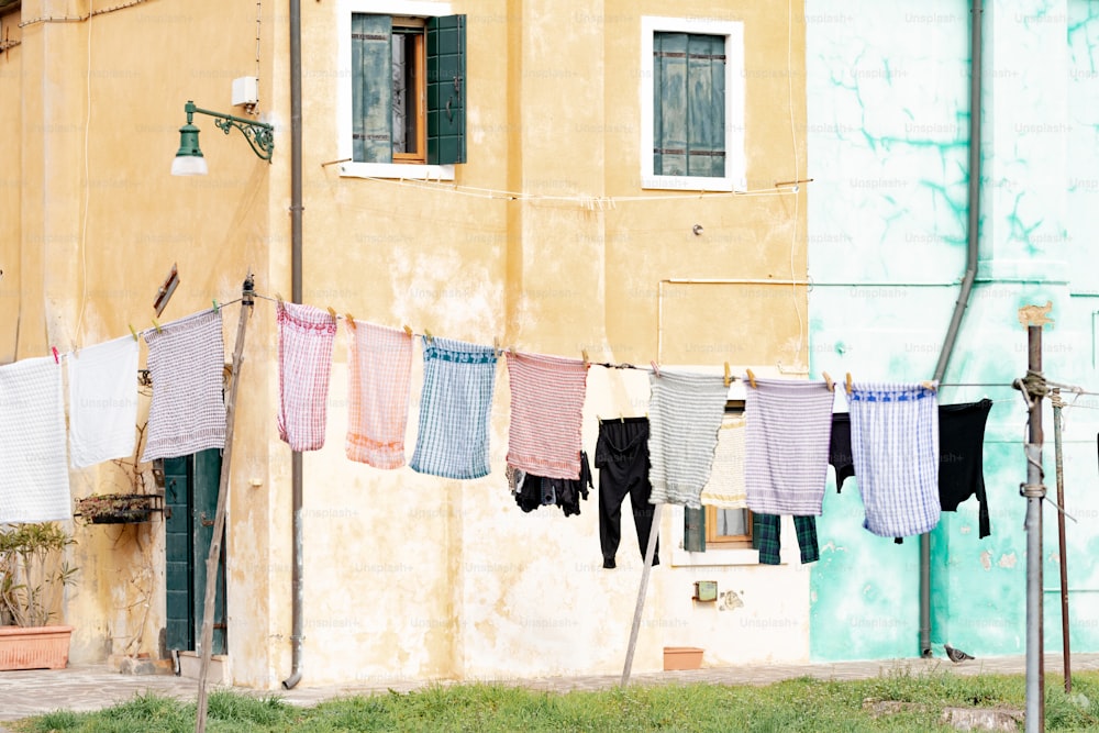 clothes hanging out to dry in front of a building