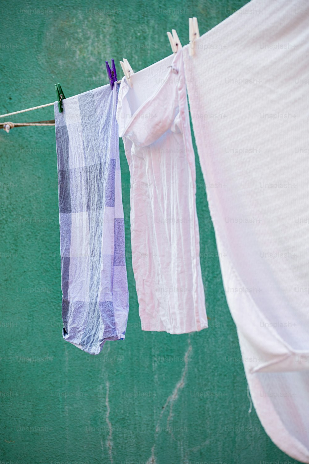 a couple of clothes hanging on a clothes line