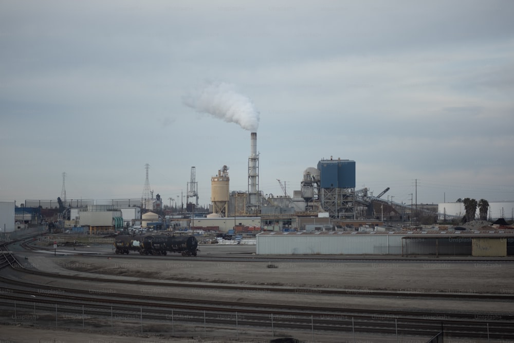 a factory with smoke coming out of it's stacks