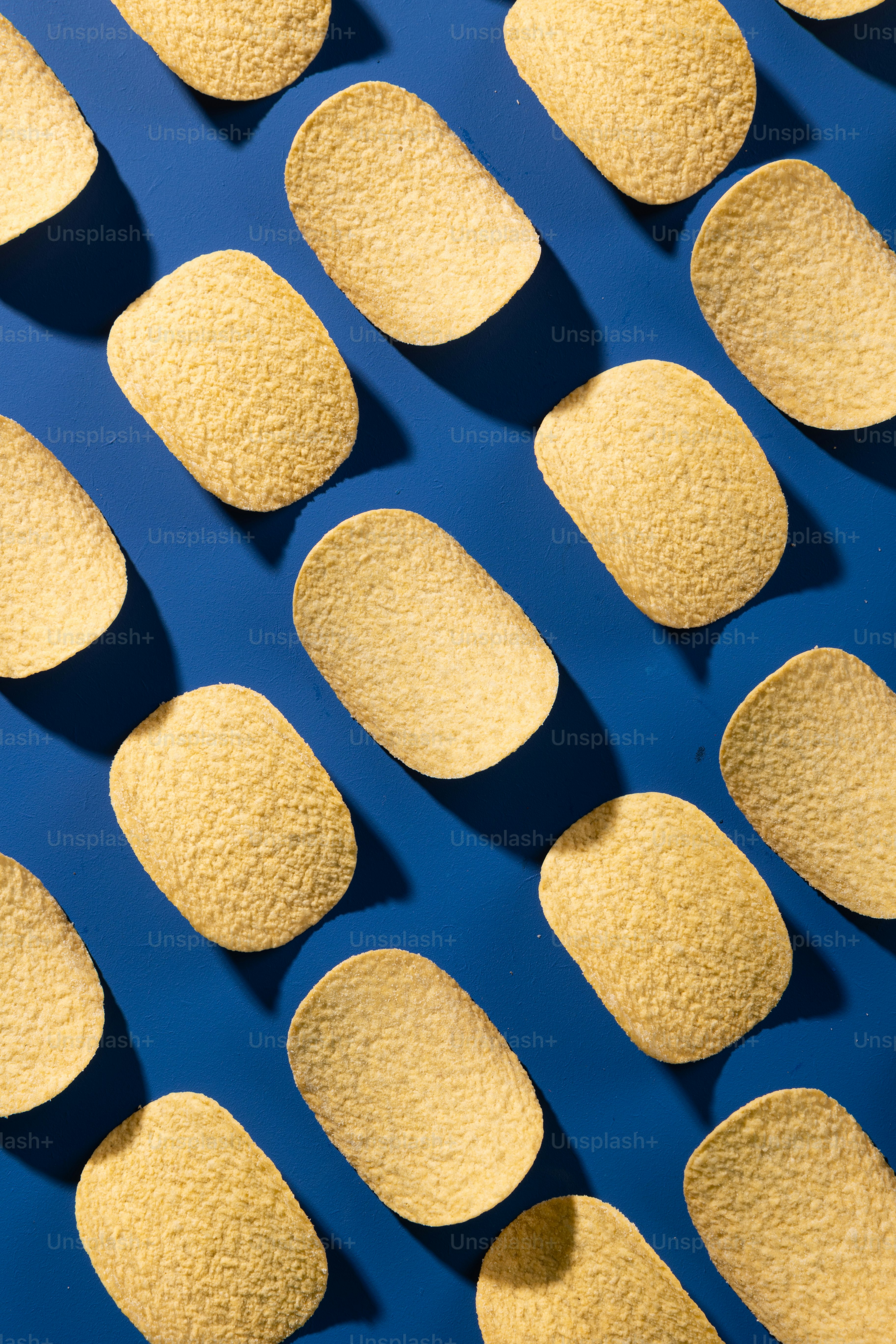 a blue surface with a bunch of yellow circles on it