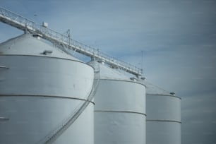 a couple of large white tanks sitting next to each other