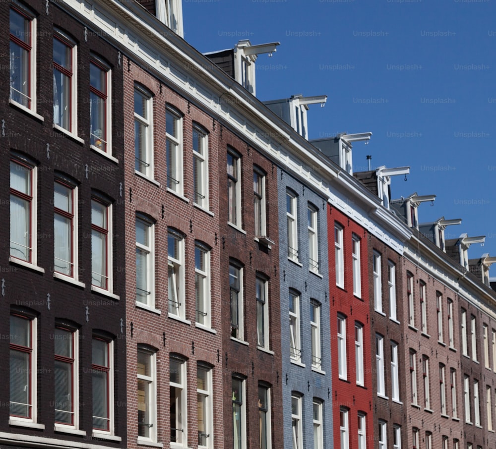 a row of red and blue brick buildings