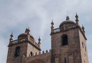 a large stone building with two towers and a clock